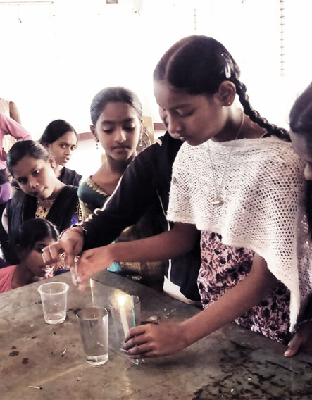 Students with hands-on science kits