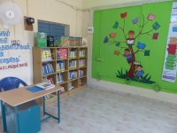 Students reading colour-coded library books during a reading period