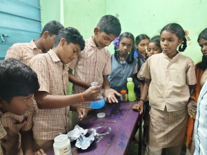 Students conducting a science experiment in their classroom