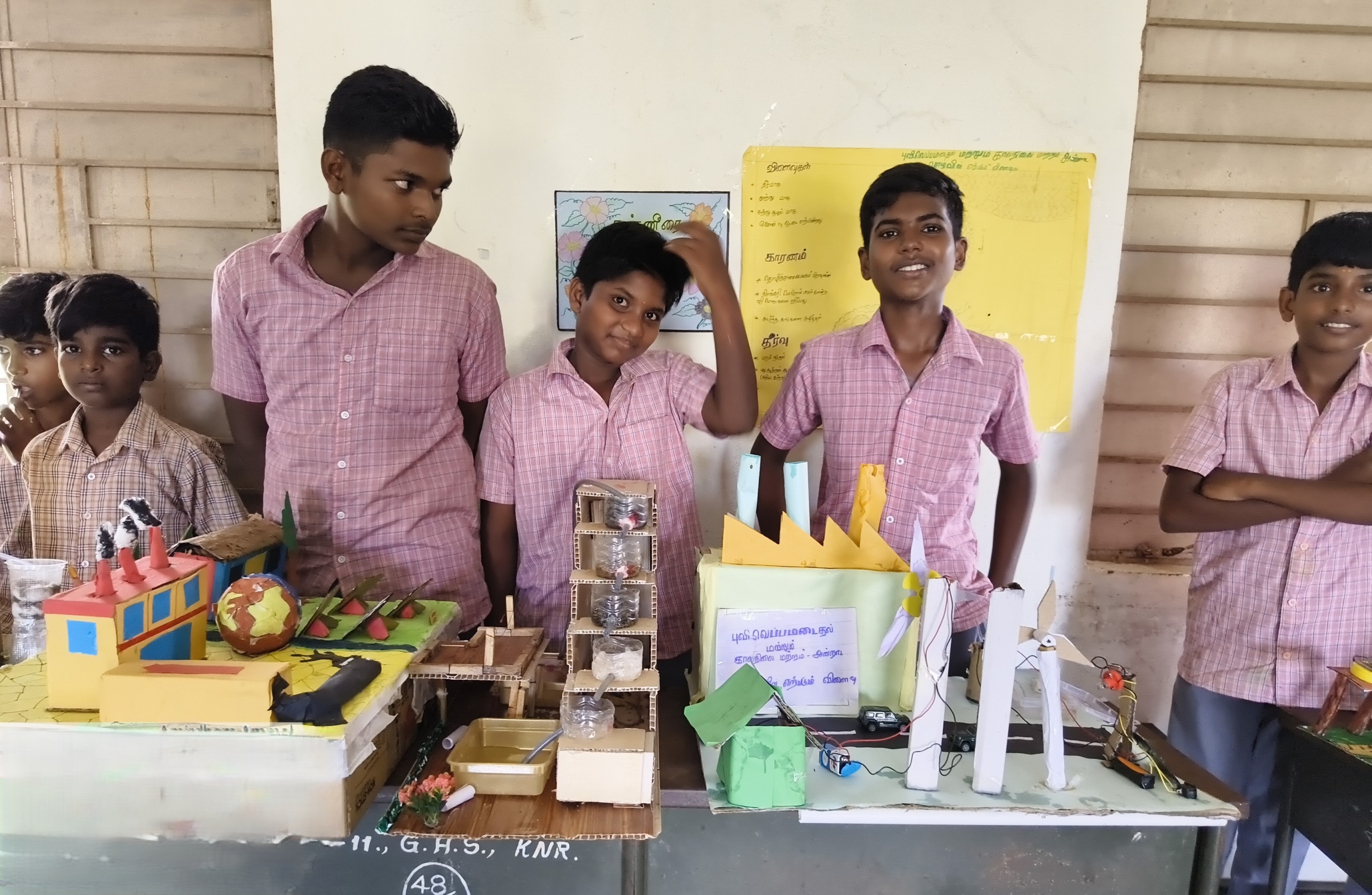 Students displaying their models in a science fair