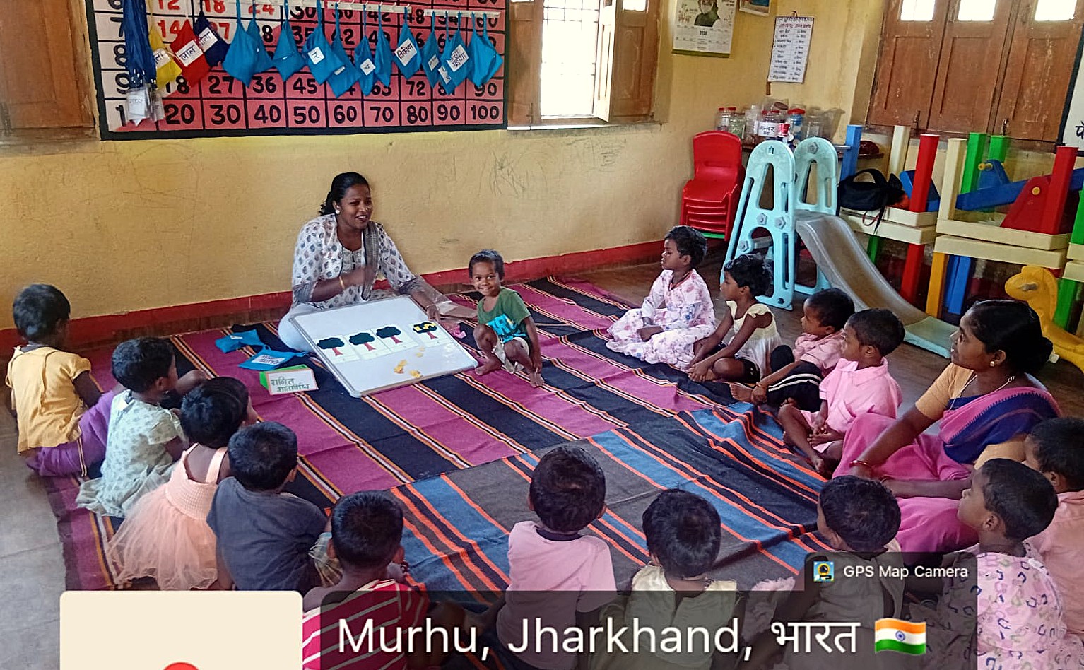 Anganwadi children engaged in play-based learning activities