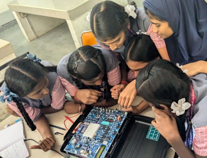 students working with electronics kits