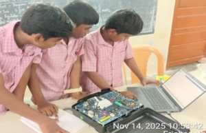 students working with electronics kits