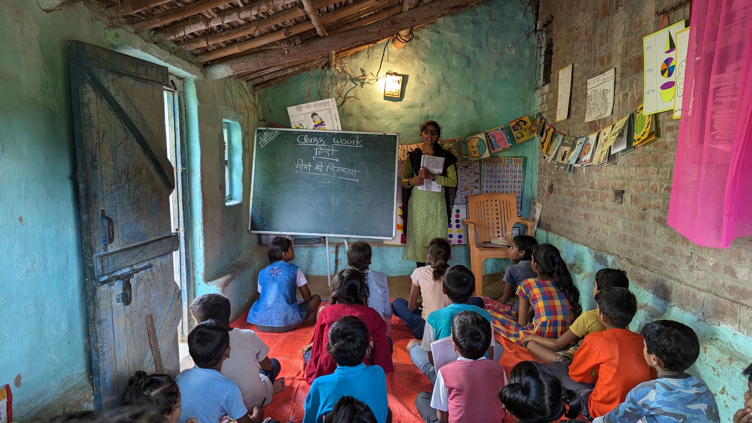 A Vidya Saathi teaches a small group of children at Village Learning Center session in UP